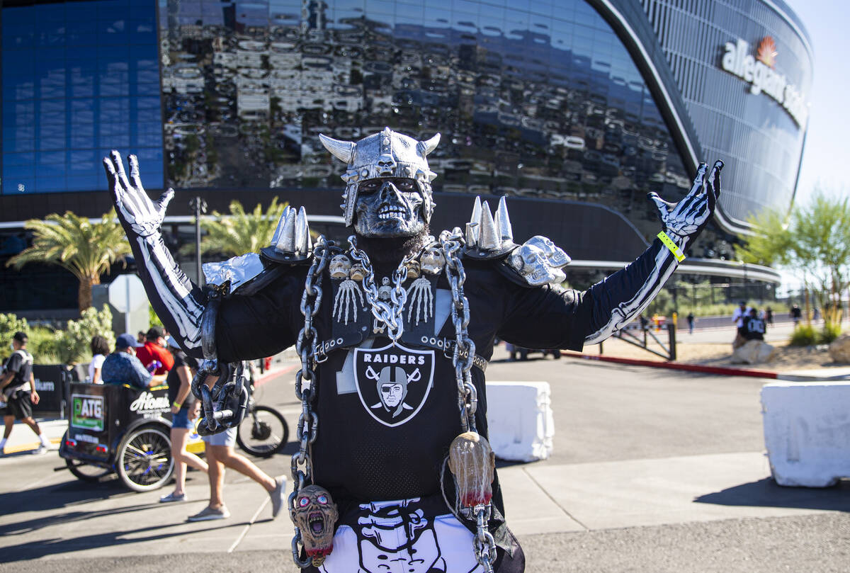 Brian McComb, of Washington, poses for a picture before an NFL game between the Raiders and the ...