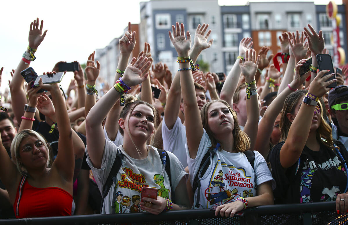 Attendees cheer as Oliver Tree, not pictured, performs at the Bacardi stage during day 3 of the ...