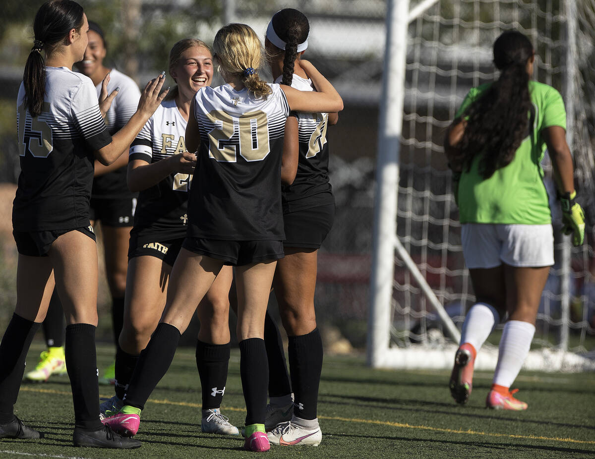 Faith Lutheran players celebrate a goal during a girls high school soccer game against Arbor Vi ...