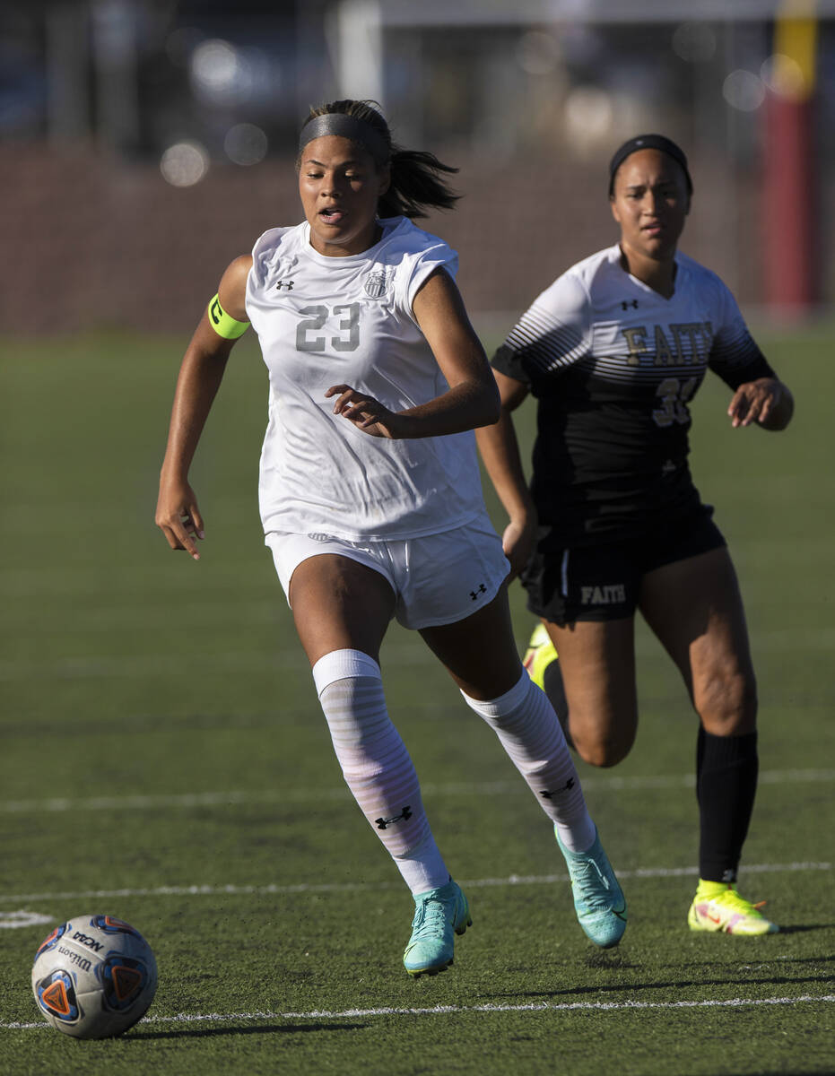 Arbor View’s Tiana Beavers (23) pushes the ball up field past Faith Lutheran’s Br ...