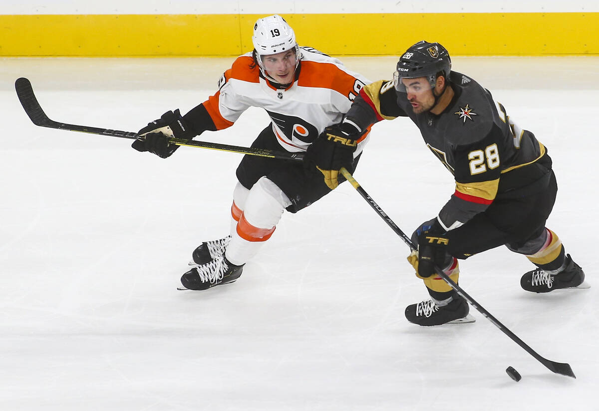 Vegas Golden Knights defenseman Dylan Coghlan (52) congratulates center Nolan  Patrick (41) afte …