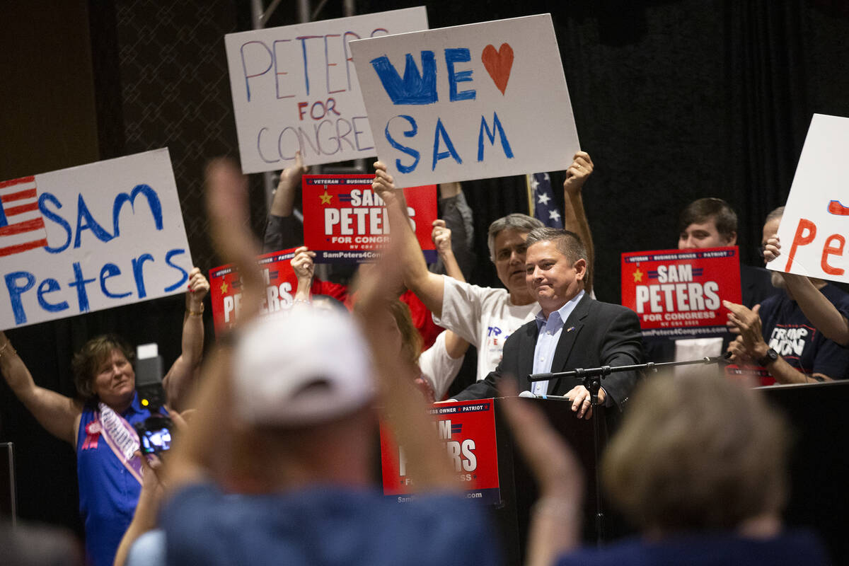 Republican Sam Peters, who is running for Nevada's 4th Congressional District, reacts as the cr ...
