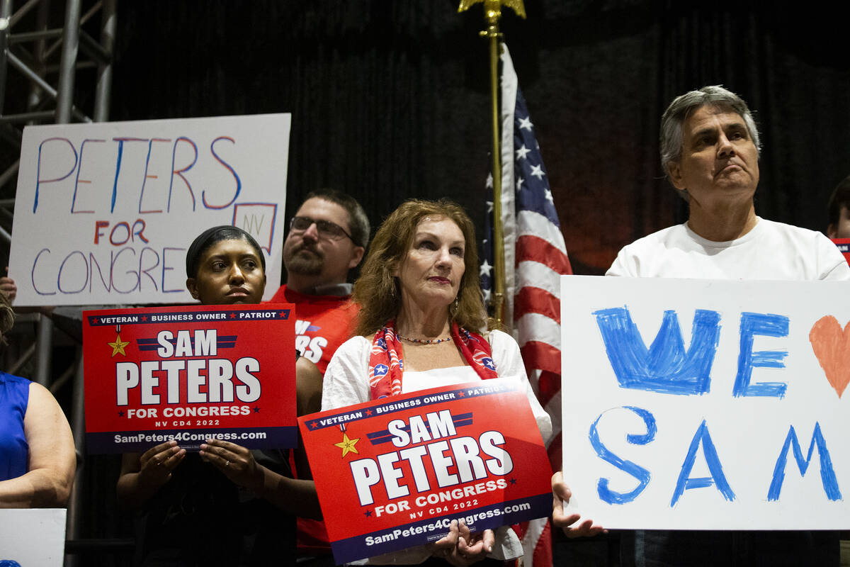 Attendees of the "Fight for Freedom" Campaign Kickoff event listen to Republican Sam Peters spe ...