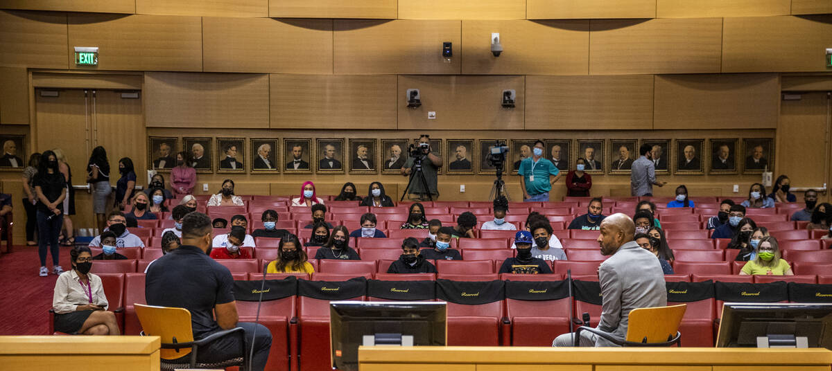 The RaidersÕ Solomon Thomas, left, and Dr. Sheldon Jacobs speak with participants during a ...