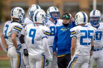 Faith Lutheran and Moapa Valley head coach Brent Lewis counsels his players as Faith Lutheran l ...