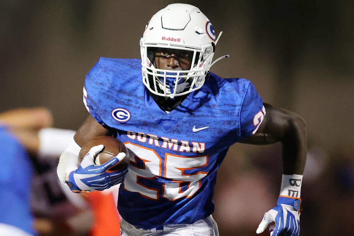 Bishop Gorman's William Stallings Jr. (25) runs the ball during the second quarter of a footbal ...