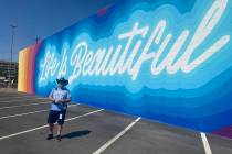 Craig Nyman poses in front of the just-finished Life Is Beautiful mural in downtown Las Vegas o ...