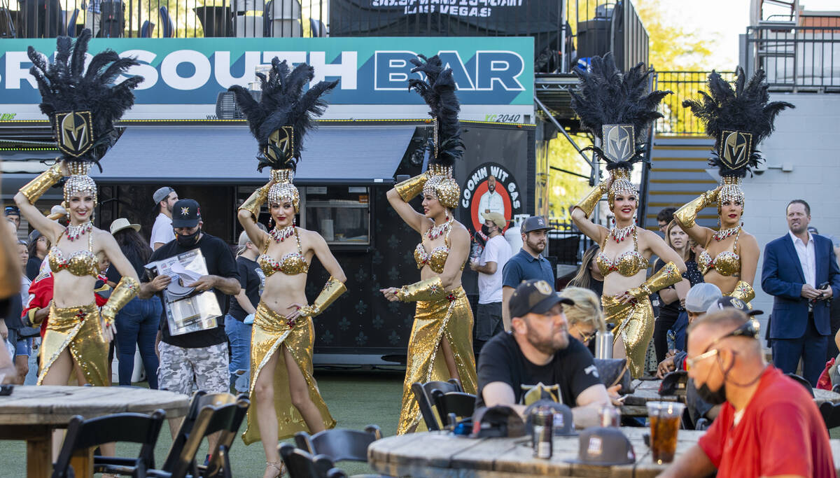 The Golden Belles walk through the crowd during the Golden Knights annual Fan Fest at the Downt ...