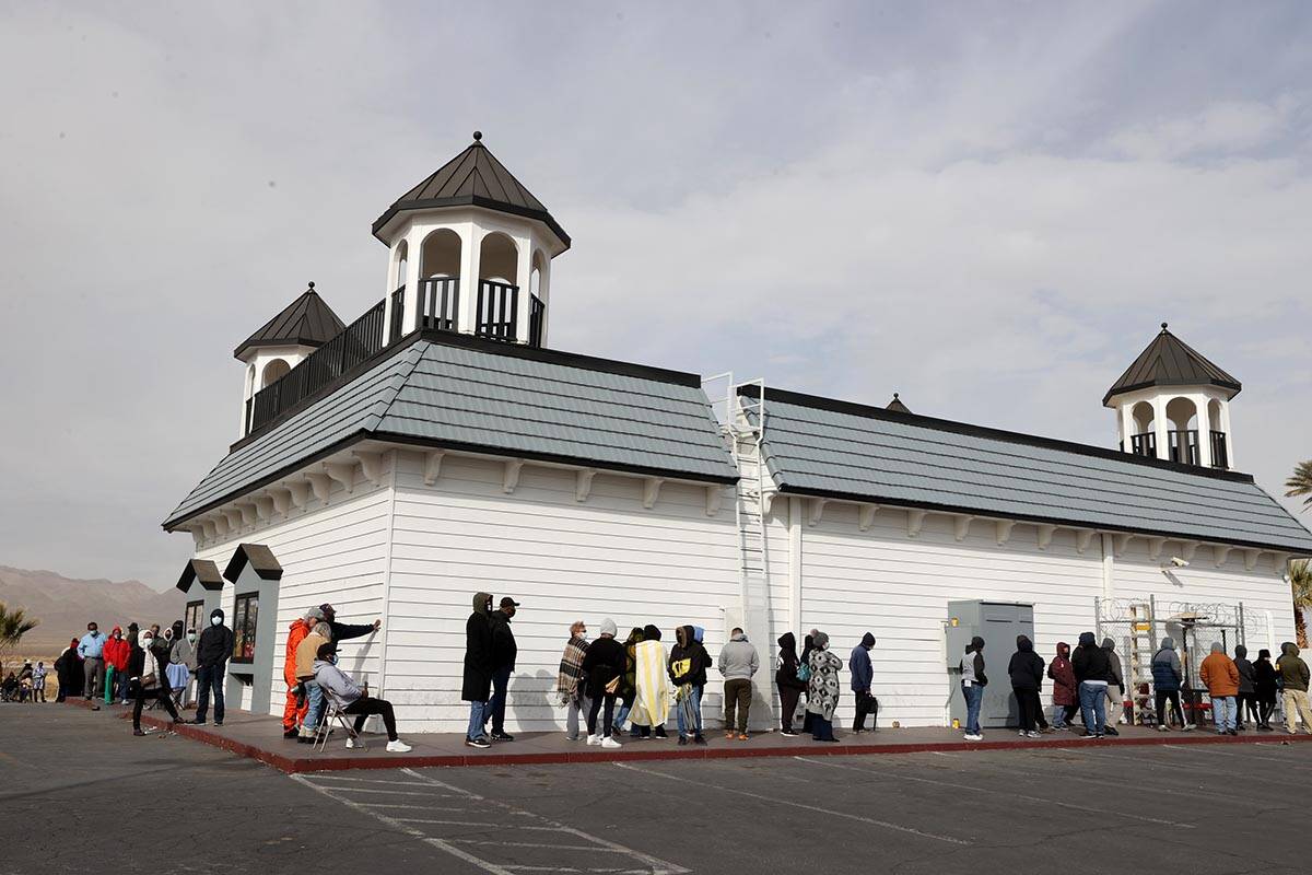 People line up to buy Powerball and Mega Millions lottery tickets at the Primm Valley Lotto Sto ...
