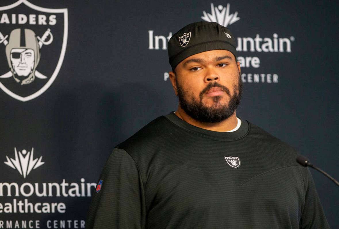 Raiders offensive tackle Jermaine Eluemunor (72) takes questions during team practice at the Ra ...