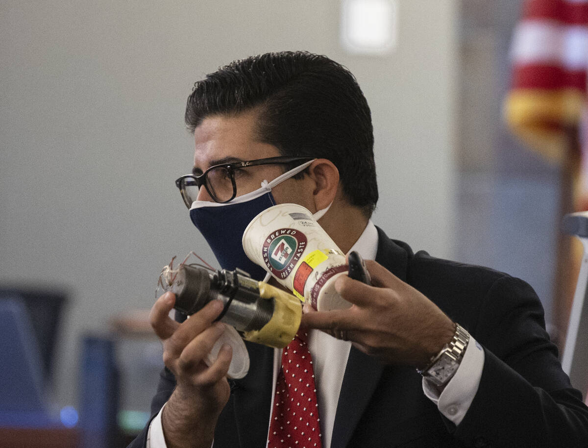 Eckley Keach, a prosecutor, holds a type of pipe bomb as he delivers a closing arguments during ...