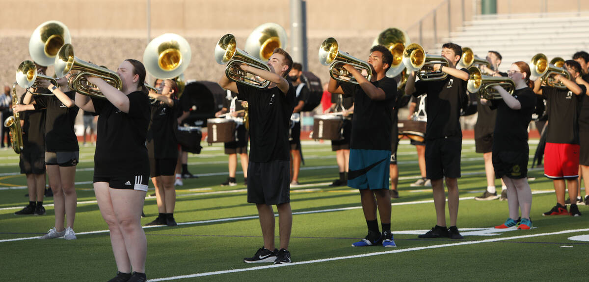 Silverado High School marching band perform before a football game against Coronado High School ...