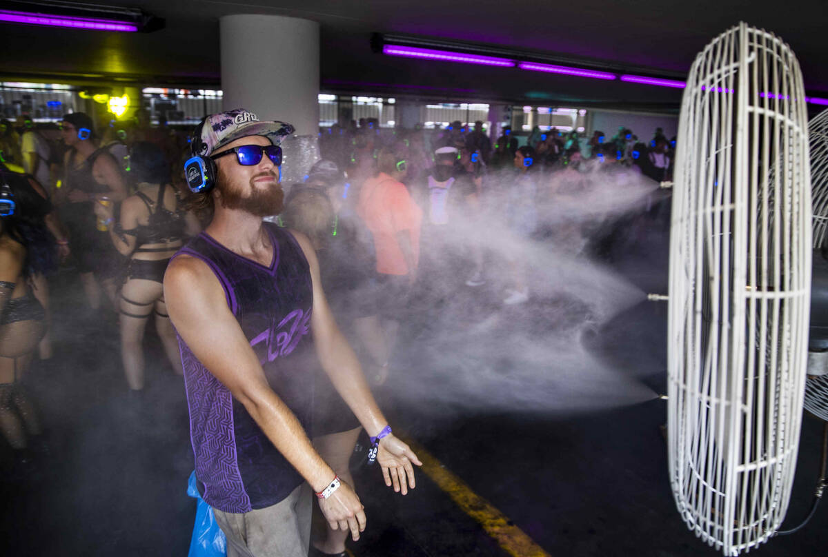 Sky Cook of Denver cools off within a silent disco in a parking lot garage off of South 7th Str ...
