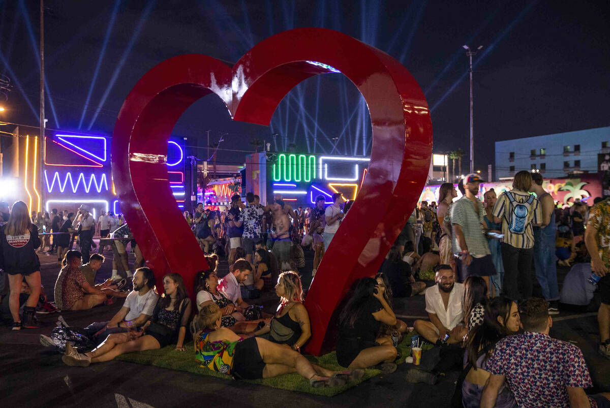 Attendees relax late in the evening about the Big Heart during day one of Life is Beautiful on ...