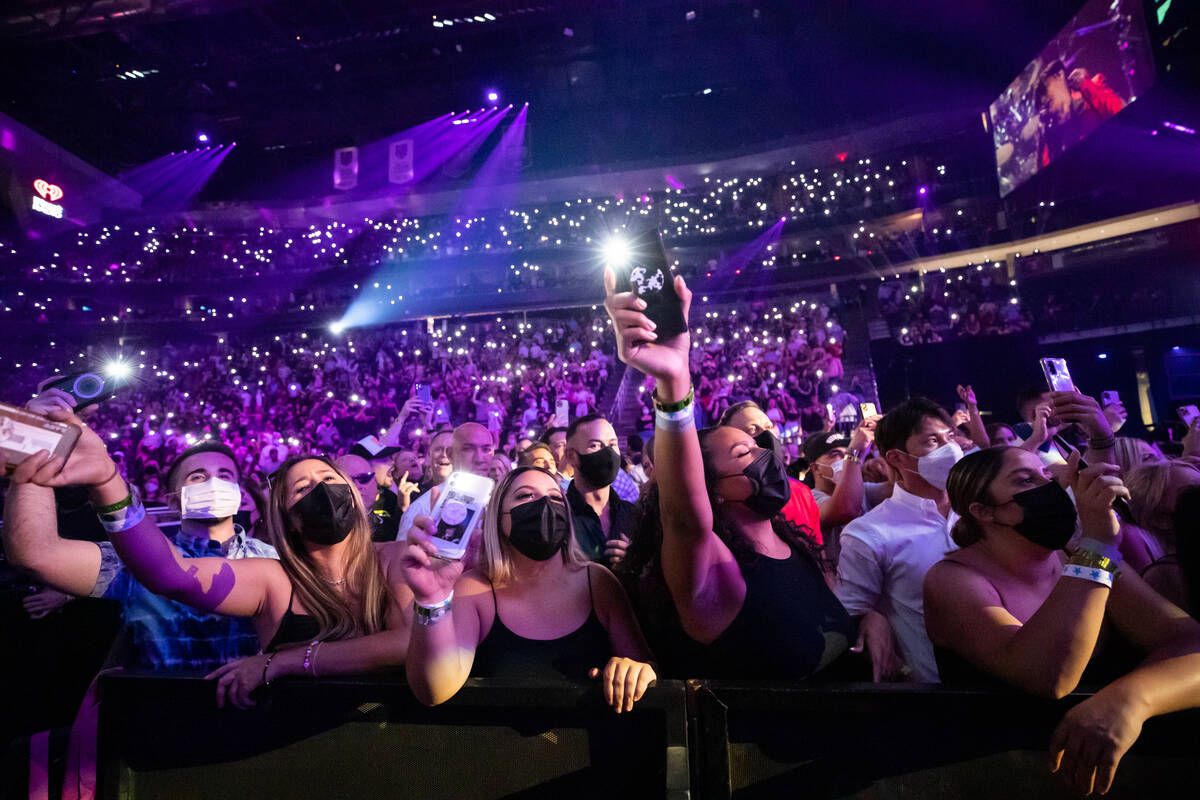 The crowd at T-Mobile Arena is shown during the Journey performance at iHeartRadio Music Festiv ...
