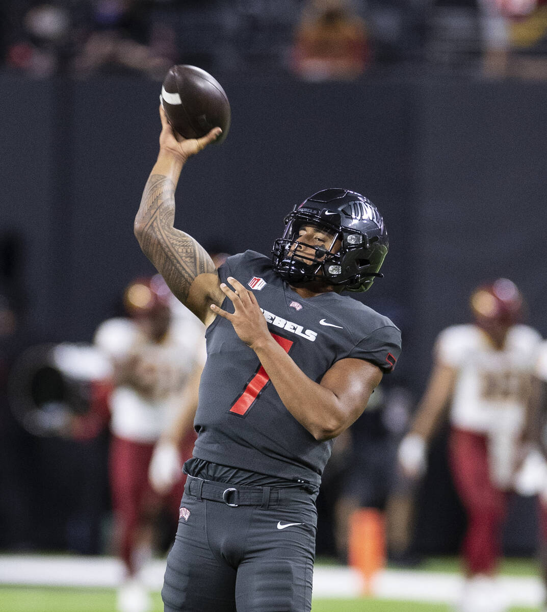 UNLV Rebels quarterback Cameron Friel (7) throws the ball as he warms up before an NCAA footbal ...