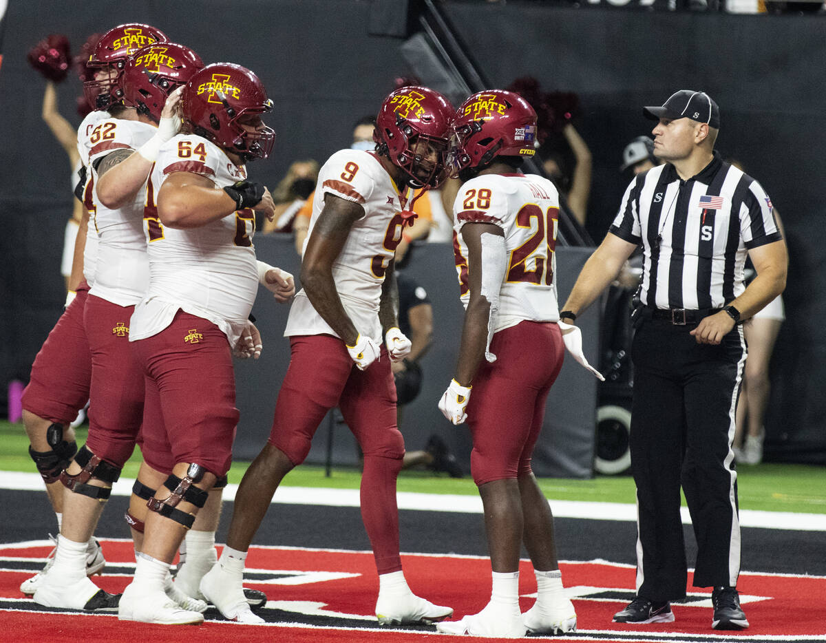 Iowa State Cyclone’s running back Breece Hall (28) celebrates his touchdown with his te ...