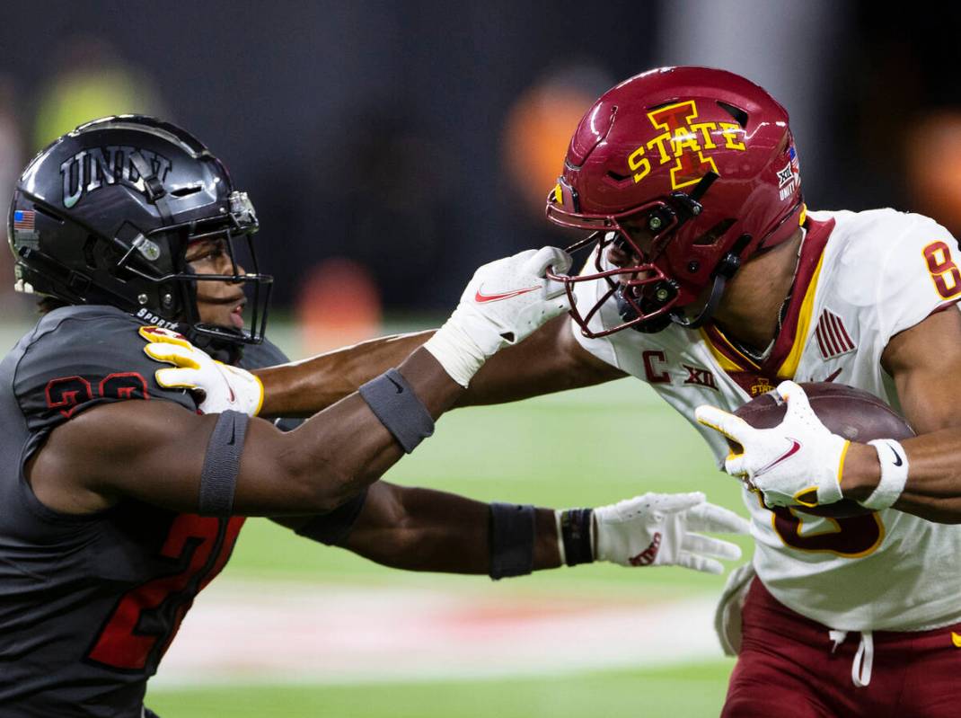 UNLV Rebels defensive back Aaron Lewis (28) holds the Iowa State CycloneÕs wide receiver X ...