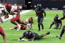 Iowa State Cyclones running back Breece Hall (28) runs with the ball as UNLV Rebels defenders, ...