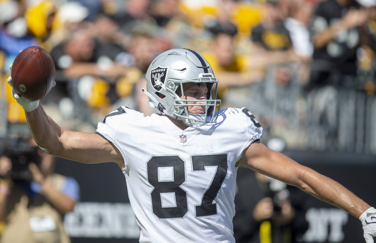 Raiders tight end Foster Moreau (87) prepares to spike the football after scoring a touchdown d ...