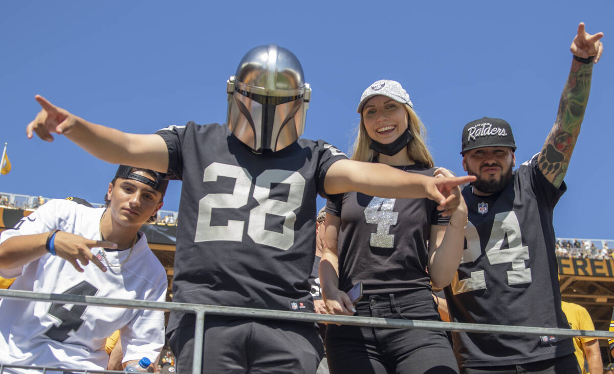 Raiders fans cheer the team on during warm ups before an NFL football game against the Pittsbur ...