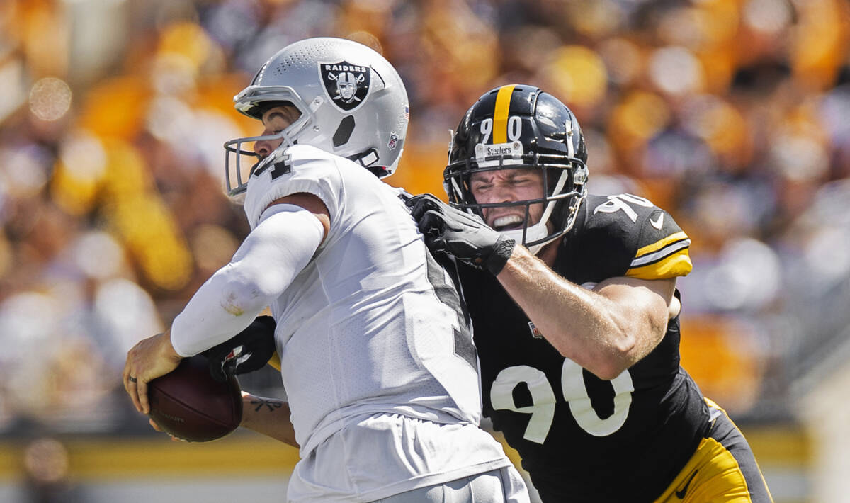 Raiders quarterback Derek Carr (4) is sacked by Pittsburgh Steelers outside linebacker T.J. Wat ...