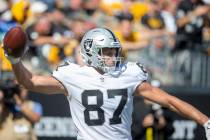 Raiders tight end Foster Moreau (87) prepares to spike the football after scoring a touchdown d ...