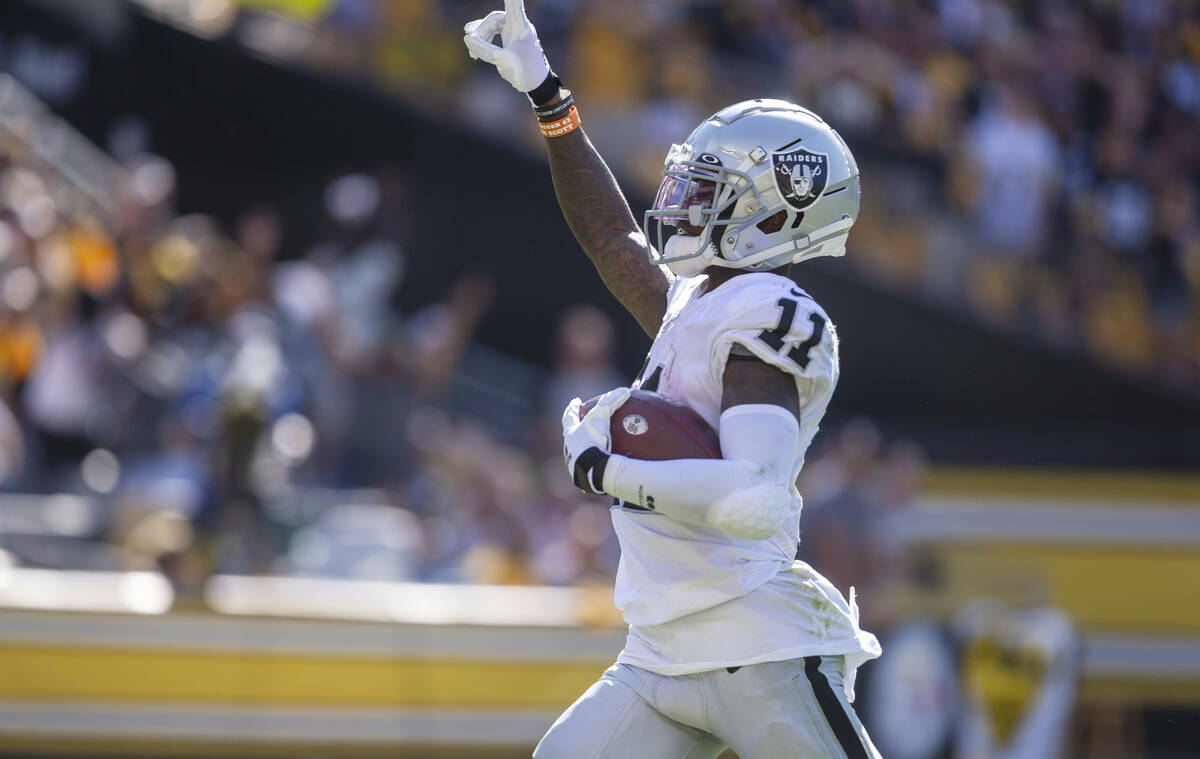 Raiders wide receiver Henry Ruggs III (11) runs into the end zone for a 61-yard touchdown durin ...