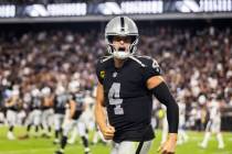 Raiders quarterback Derek Carr (4) celebrates a touchdown in the fourth quarter during an NFL f ...