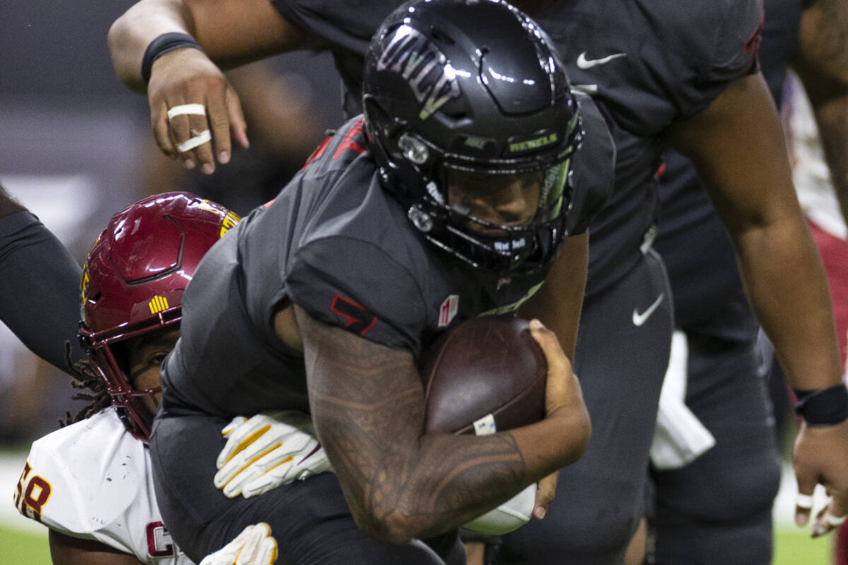UNLV Rebels quarterback Cameron Friel (7) sucked by Iowa State Cyclone’s defensive end E ...