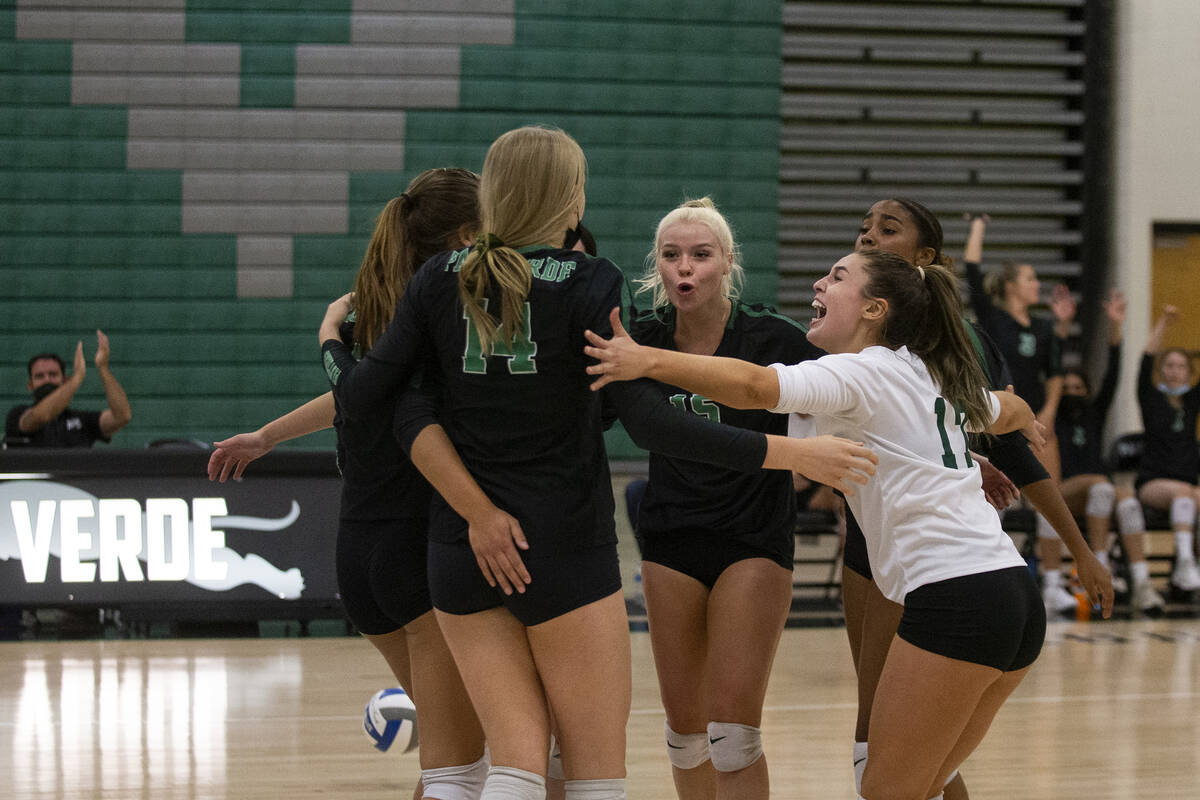 Palo Verde celebrates a point, including Kate Camp (14), Rilee Reed (15), center, and Brooke Pa ...