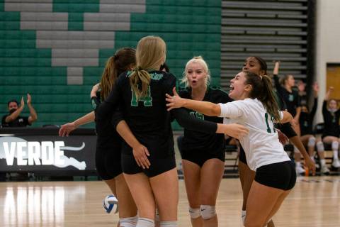 Palo Verde celebrates a point, including Kate Camp (14), Rilee Reed (15), center, and Brooke Pa ...