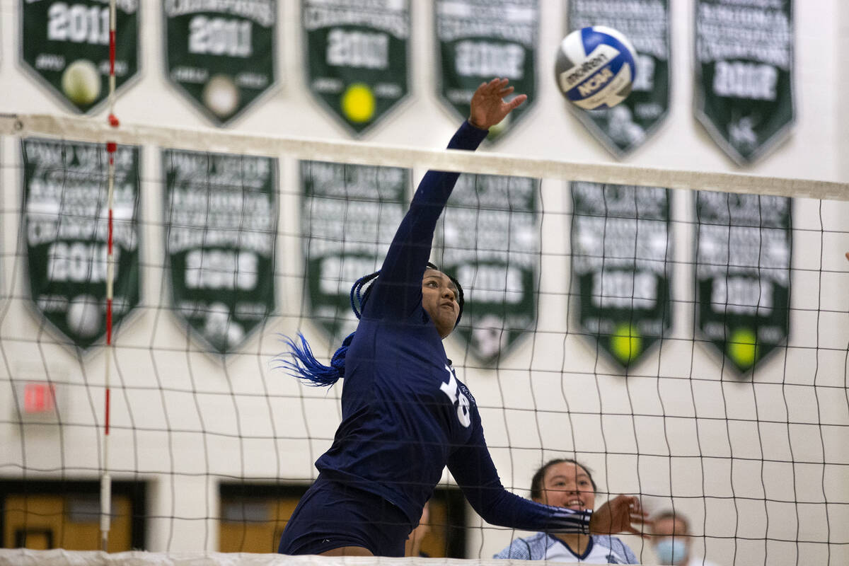 Shadow Ridge's Jocelyn Sanders (16) spikes to Palo Verde during their precocious   schoolhouse  volleyball ga ...