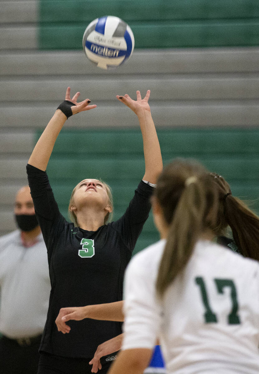 Palo Verde's C.J. Hausler (3) sets to a teammate during their high school volleyball game again ...