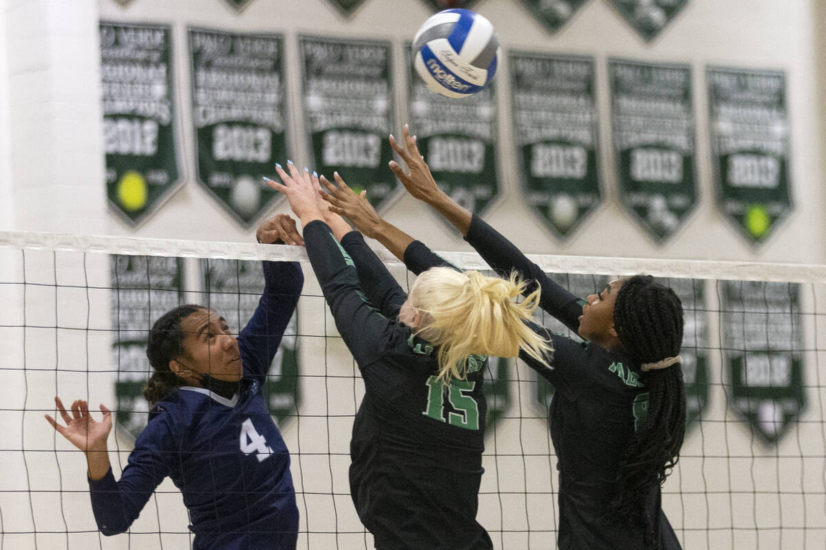 Palo Verde's Rilee Read (15) and Naomi White (8) termination  a changeable  by Shadow Ridge's Moni Jerome (4) ...