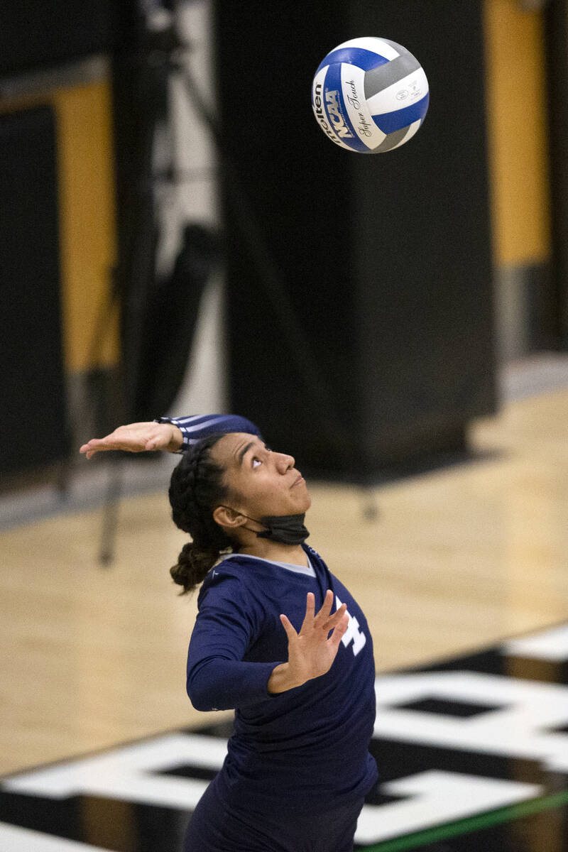 Shadow Ridge's Moni Jerome (4) serves to Palo Verde during their precocious   schoolhouse  volleyball crippled  astatine  ...