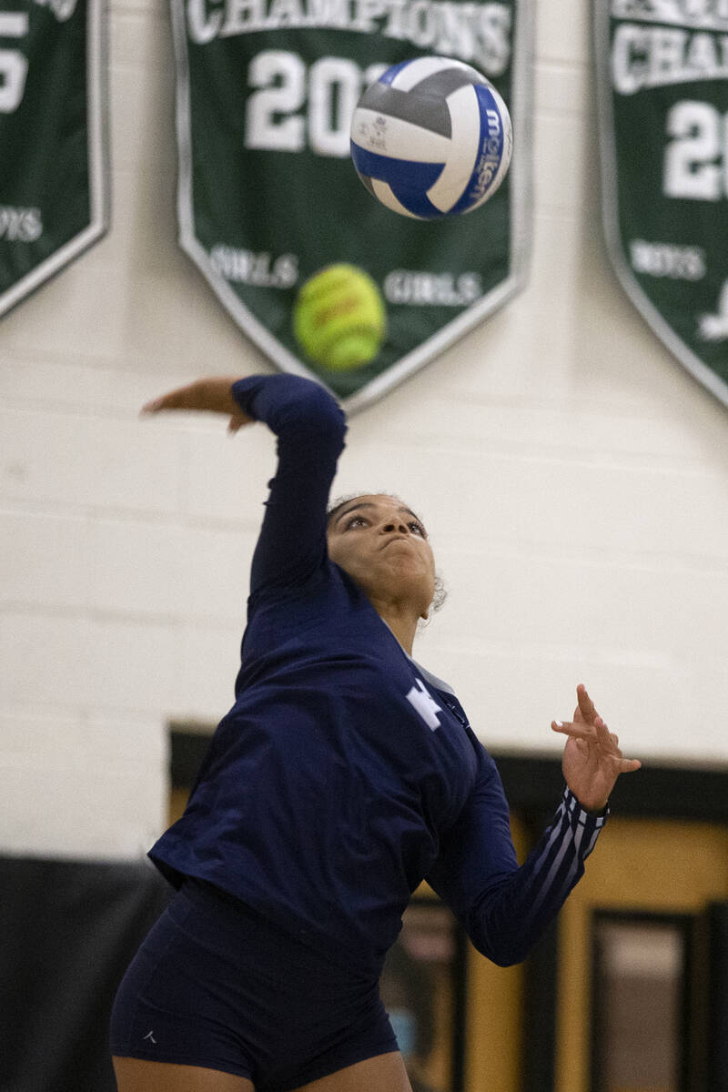 Shadow Ridge's Desirae Knoble (7) serves to Palo Verde during their precocious   schoolhouse  volleyball crippled  ...