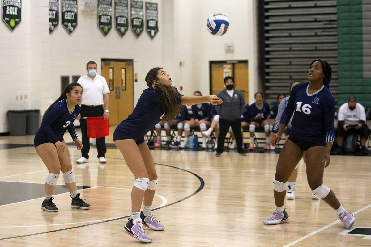 Shadow Ridge's Chloe Poort (6) bumps the shot  during their precocious   schoolhouse  volleyball crippled  against ...