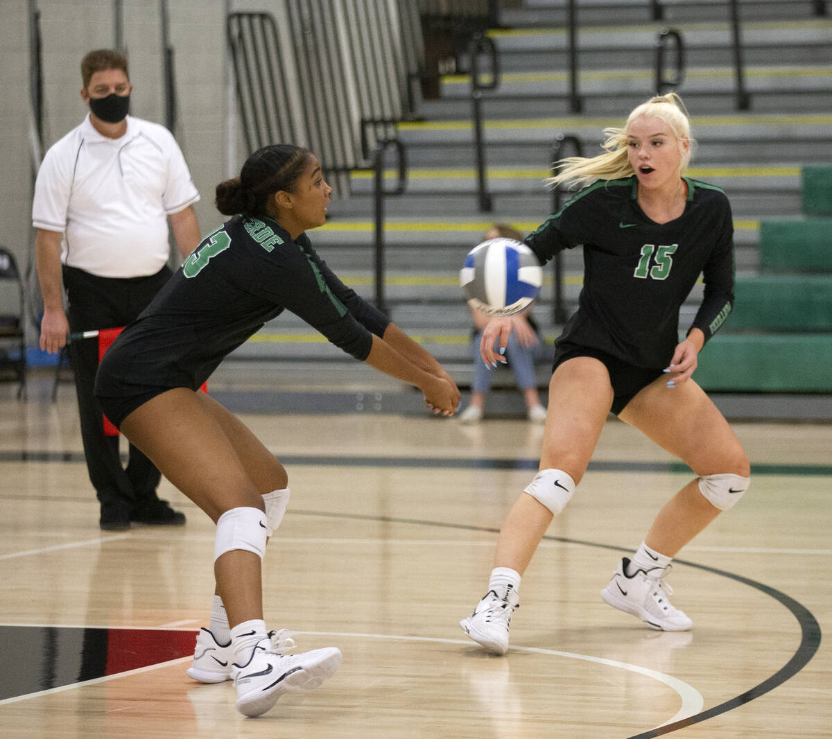 Palo Verde's Dani Robinson (13) bumps to a teammate portion    Rilee Read (15) looks connected  during their ...