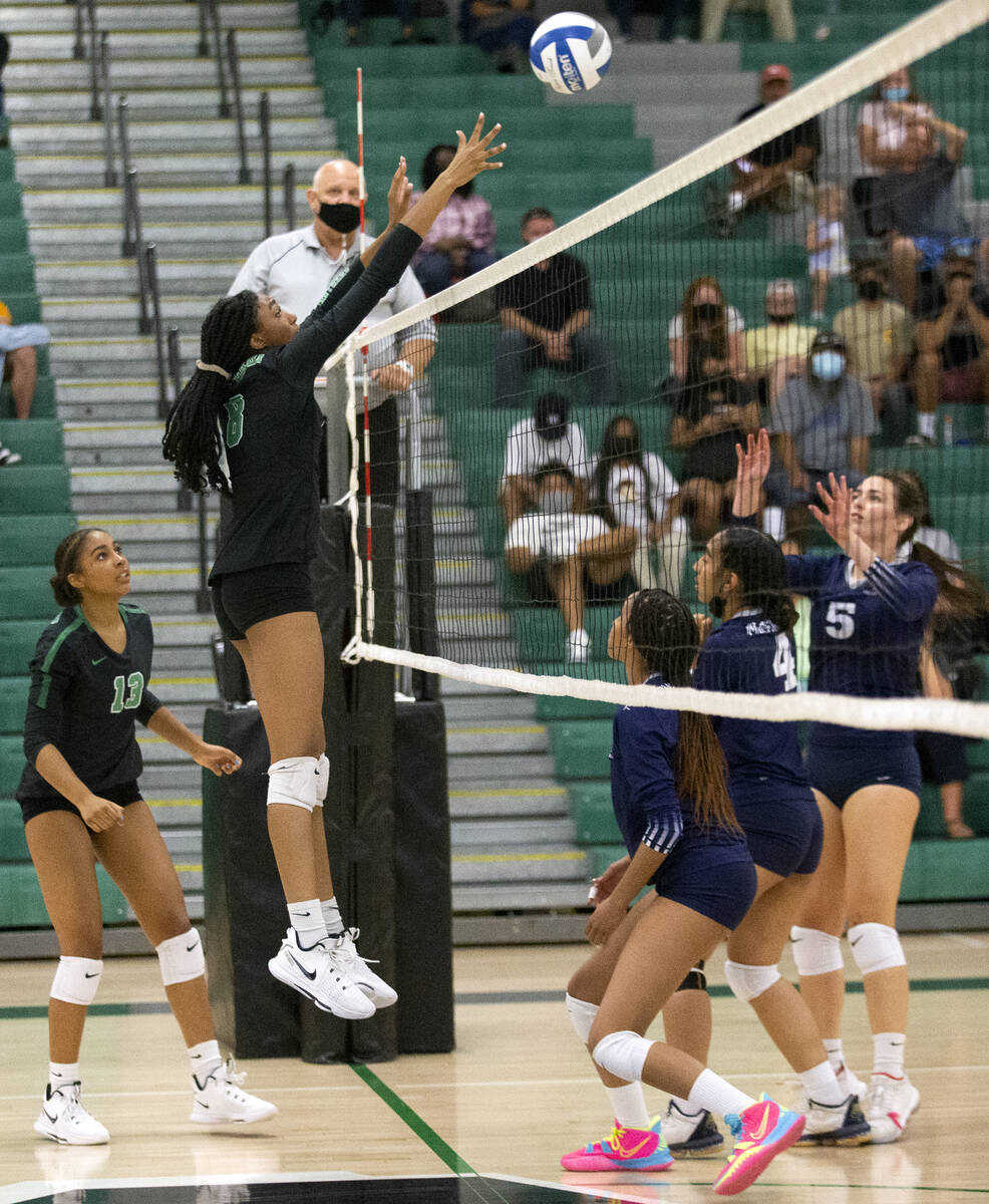 Palo Verde's Naomi White (8) sets implicit    to Shadow Ridge portion    her teammate Dani Robinson (13) lo ...