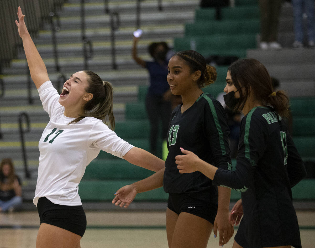 Palo Verde's Brooke Paige (17), Dani Robinson (13) and Ana Badio (11) celebrate winning three o ...