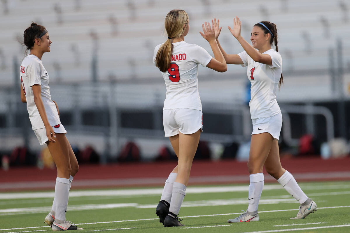 Coronado's Alexis Pashales (7) celebrates her extremity   with Molly Russell (9) during the 2nd  hal ...