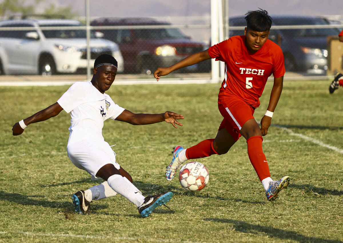 Spring Valley's Piyo Mulonda (11) moves the ball around Southeast Career Tech's Carlos Rivera ( ...