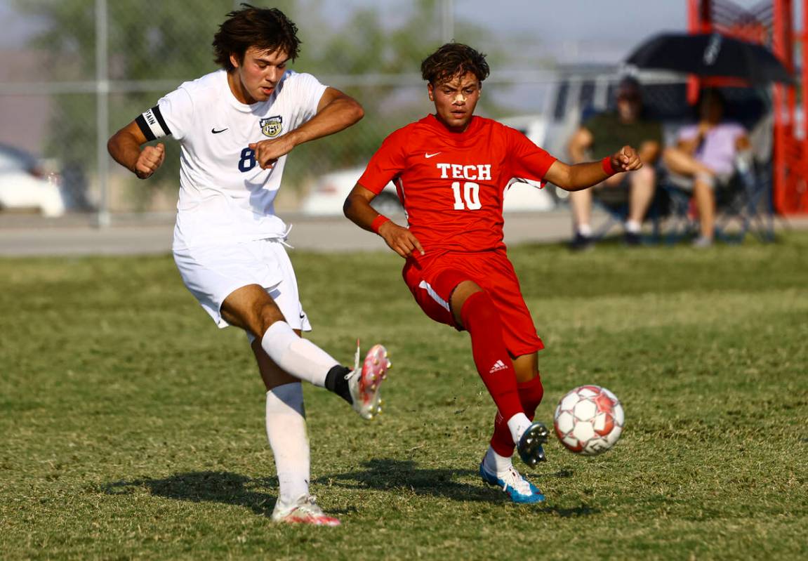 Spring Valley's Dejan Krstic (8) fights for the ball against Southeast Career Tech's Estevan Za ...