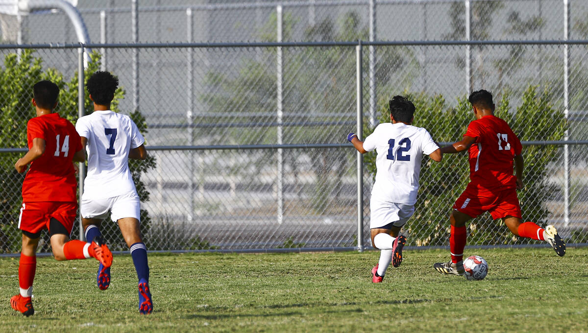 Southeast Career Tech's Jose Lopez (17) moves the ball to score a goal past Spring Valley's Jon ...