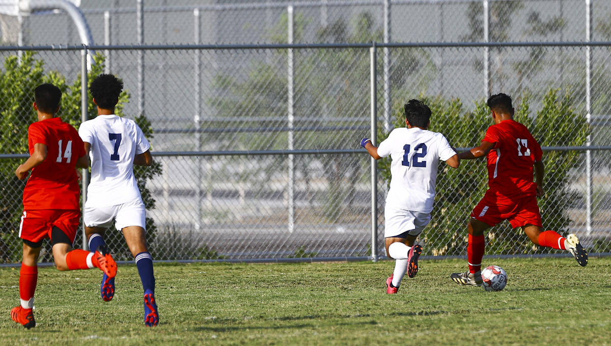 Southeast Career Tech's Jose Lopez (17) moves the ball to score a goal past Spring Valley's Jon ...