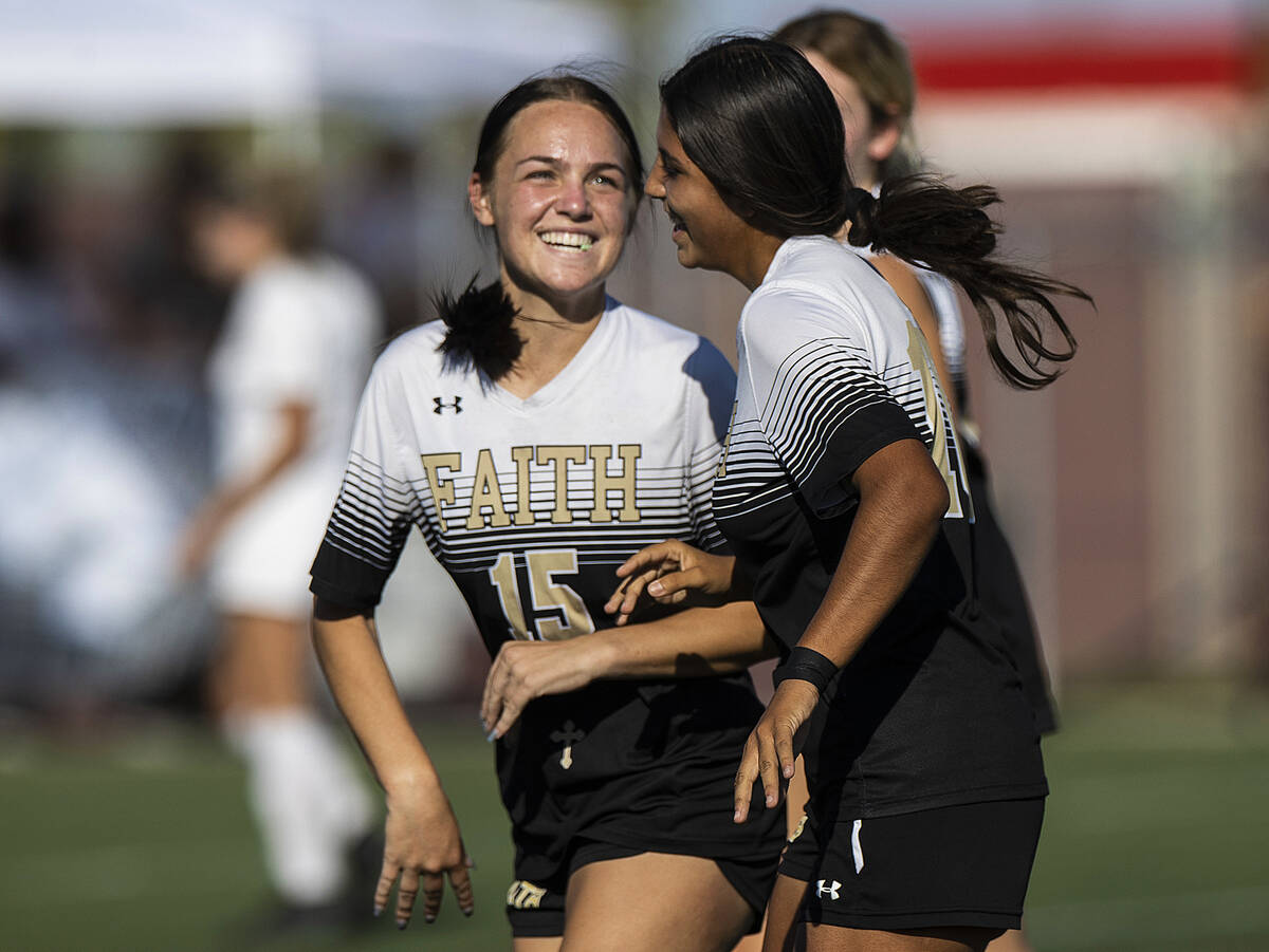 Faith Lutheran’s Serene Gronauer (15) and Andrea Leyva (10) celebrate a goal during a gi ...