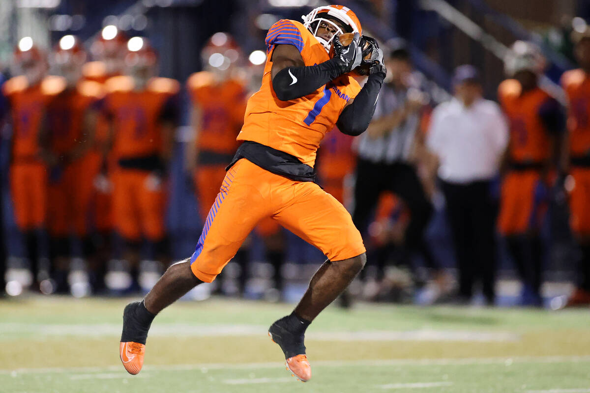 Bishop Gorman's Zachariah Branch (1) runs the ball for a touchdown after a catch in the fourth ...