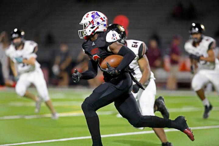 Liberty High School's Germie Bernard (2), center, runs into the end zone for a touchdown during ...
