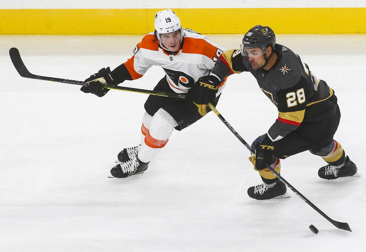 Golden Knights left wing William Carrier (28) moves the puck past Philadelphia Flyers center No ...
